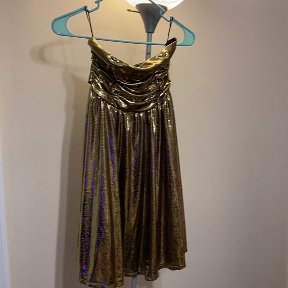 Gold shiny strapless dress with bow on back. - Picture 1 of 3